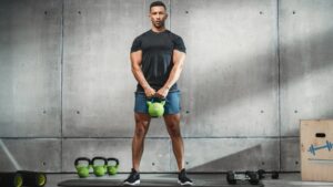 How to do the kettlebell deadlift to master your hip hinge by: Barbend