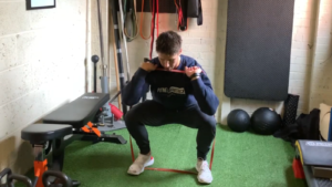 Banded Front Squat by: The Fitness Maverick