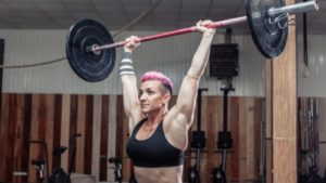 7 benefits of overhead carries by: Barbend